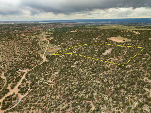 Aerial view of sparsely populated area with property boundaries highlighted