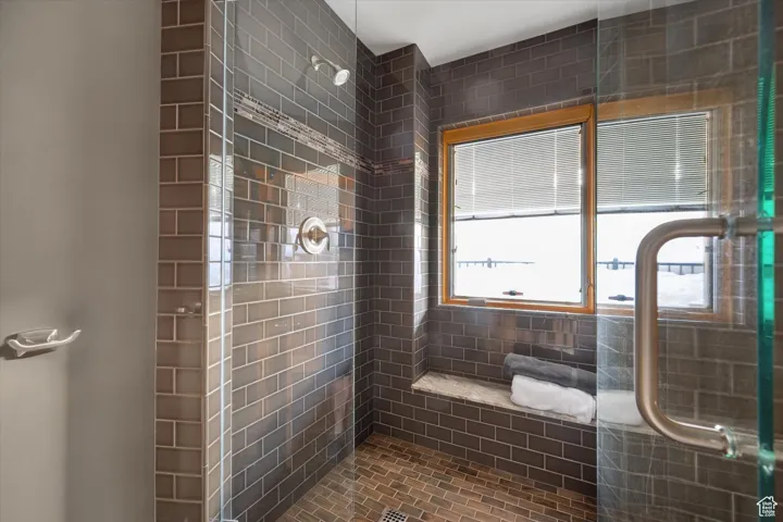 Bathroom featuring a shower stall