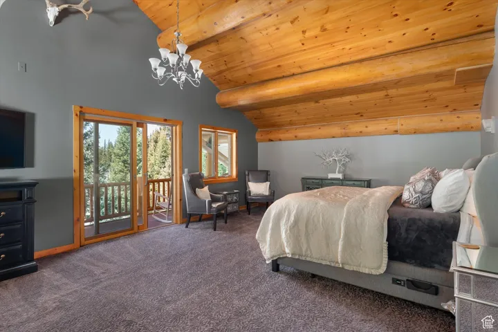 Bedroom with access to outside, a chandelier, wood ceiling, and carpet floors