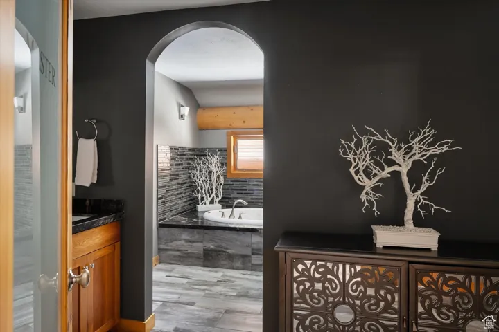 Bathroom with a bath and vanity