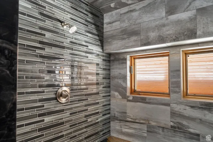 Full bathroom featuring tiled shower