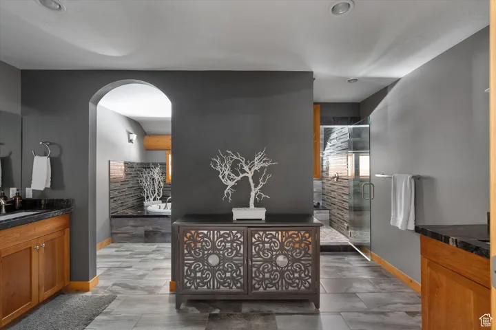Reception with arched walkways and a sink