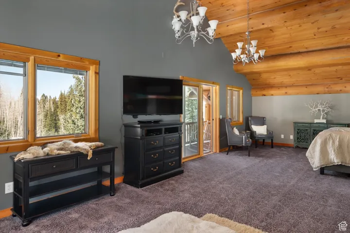 Bedroom featuring a chandelier, access to outside, carpet floors, high vaulted ceiling, and wood ceiling