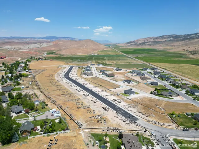 Aerial view of property's location featuring mountains