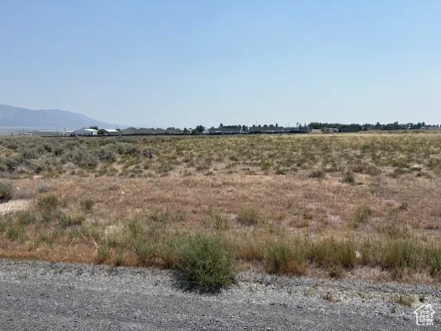 View of mountain backdrop with rural landscape