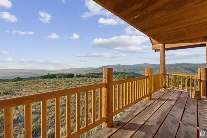 Wooden deck featuring a mountain view