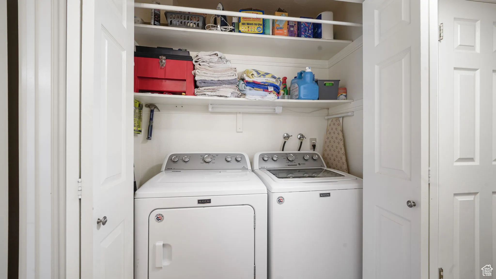 Laundry area with washing machine and clothes dryer