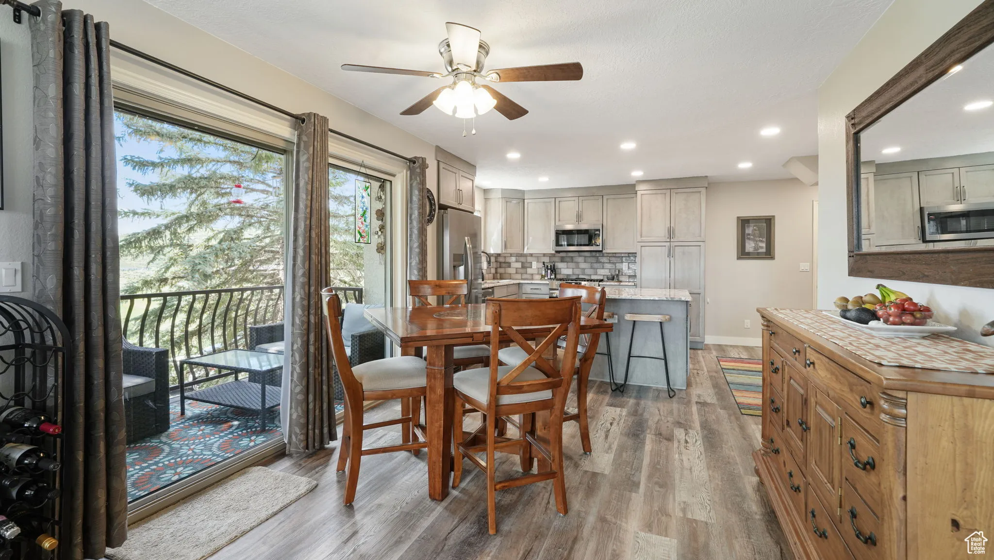 Dining space featuring a ceiling fan, light wood-type flooring, and recessed lighting