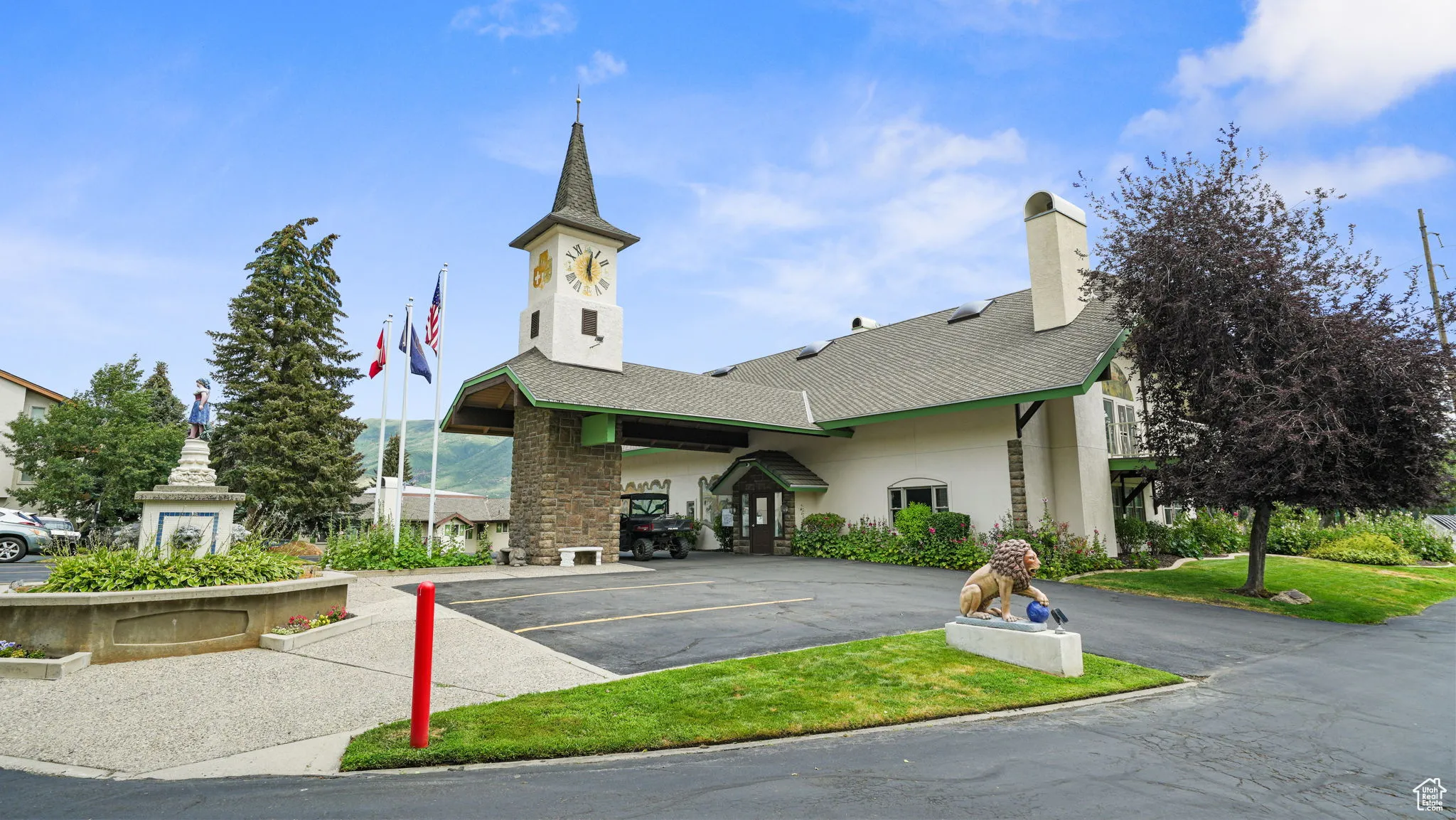 View of building exterior featuring uncovered parking