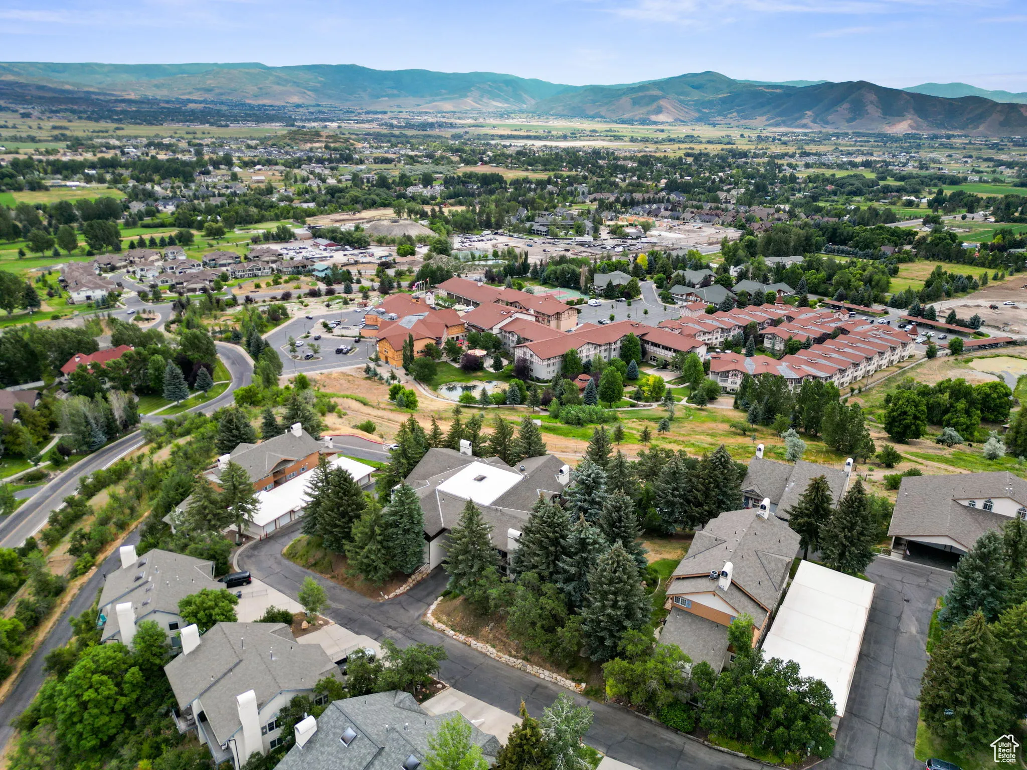Aerial view of residential area featuring mountains