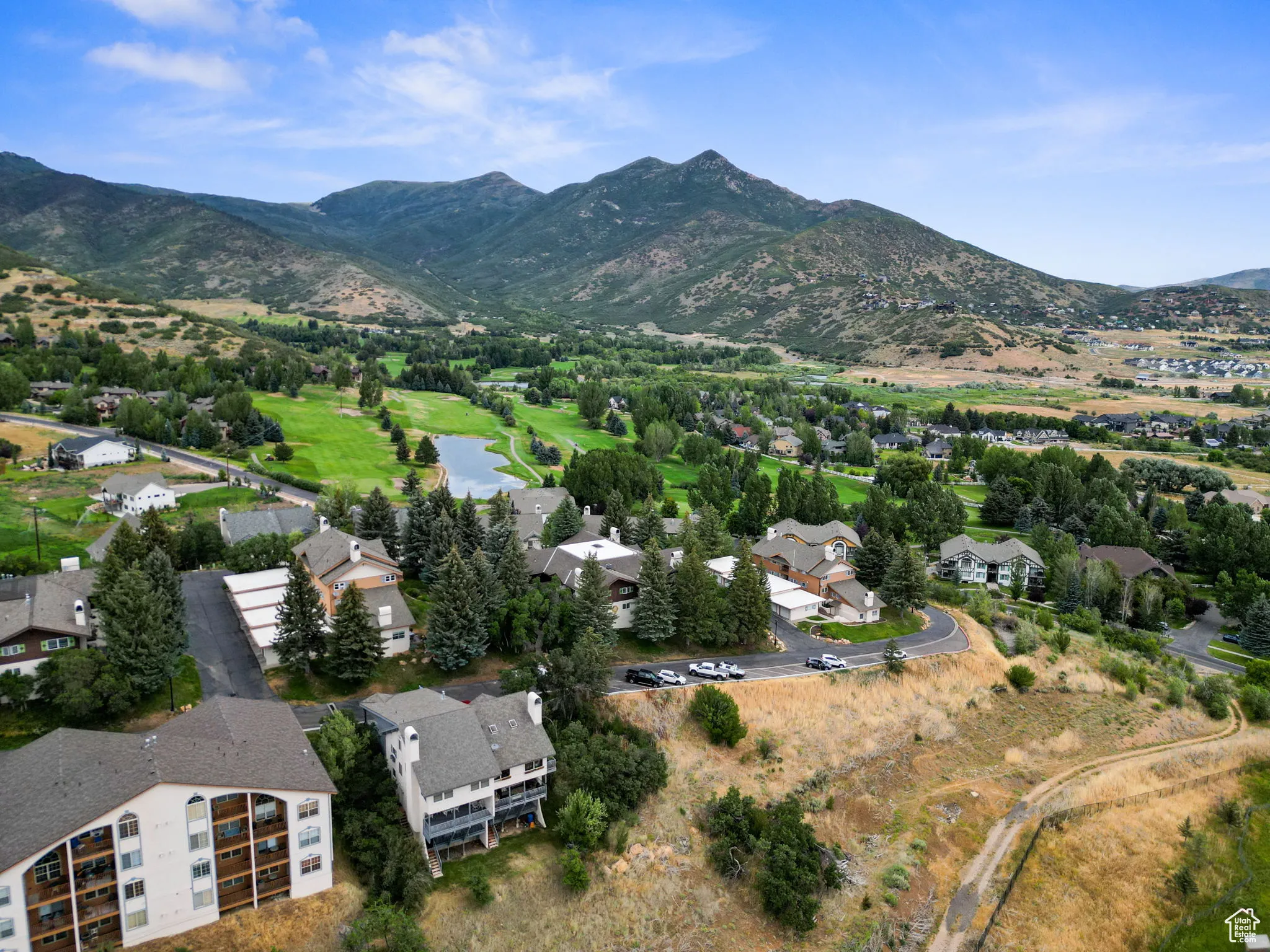Aerial overview of property's location featuring a water and mountain view