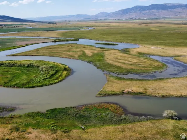 View of property location with a water and mountain view