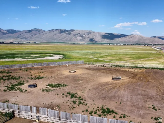 View of mountain backdrop featuring rural landscape