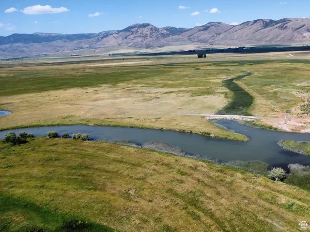 Mountain view with a large body of water and rural landscape