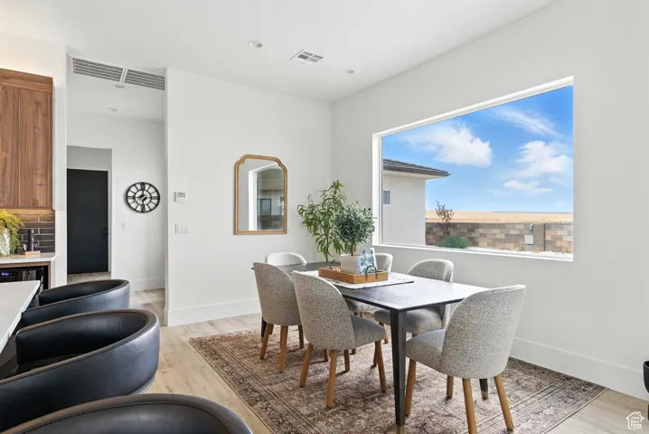 Dining room with light wood-style flooring