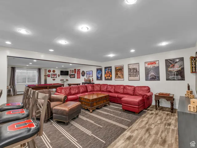 Living area with recessed lighting, wood finished floors, and billiards table