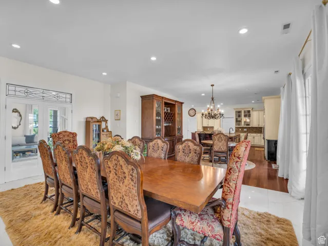 Dining area featuring a chandelier and recessed lighting