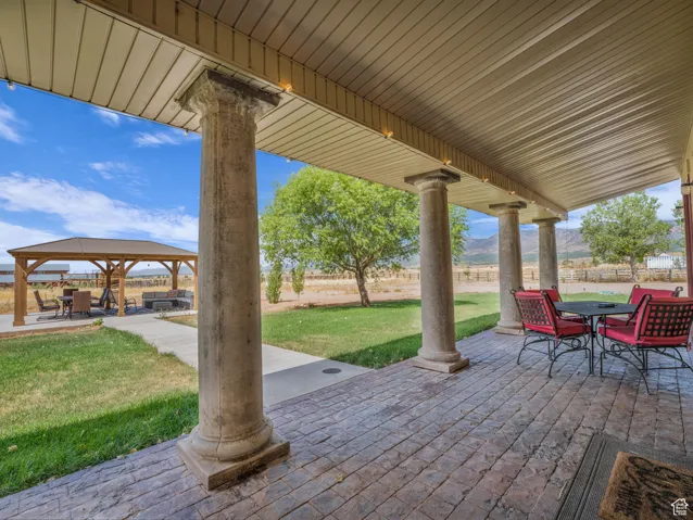 View of patio featuring a gazebo and outdoor dining area