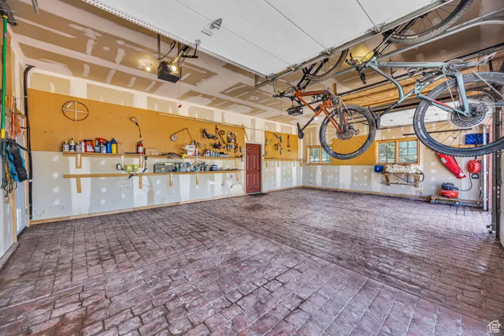 Garage with a garage door opener, 3 bay, with stamped concrete