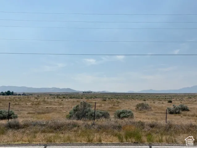 View of yard featuring a mountain view and a rural view