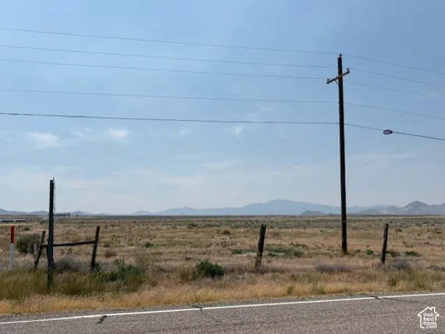 View of mountain backdrop featuring rural landscape