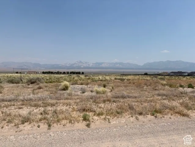 View of mountain backdrop featuring rural landscape
