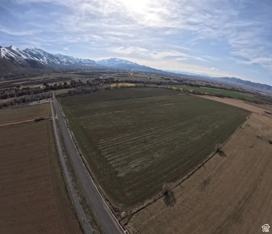 Aerial view of sparsely populated area with a mountainous background