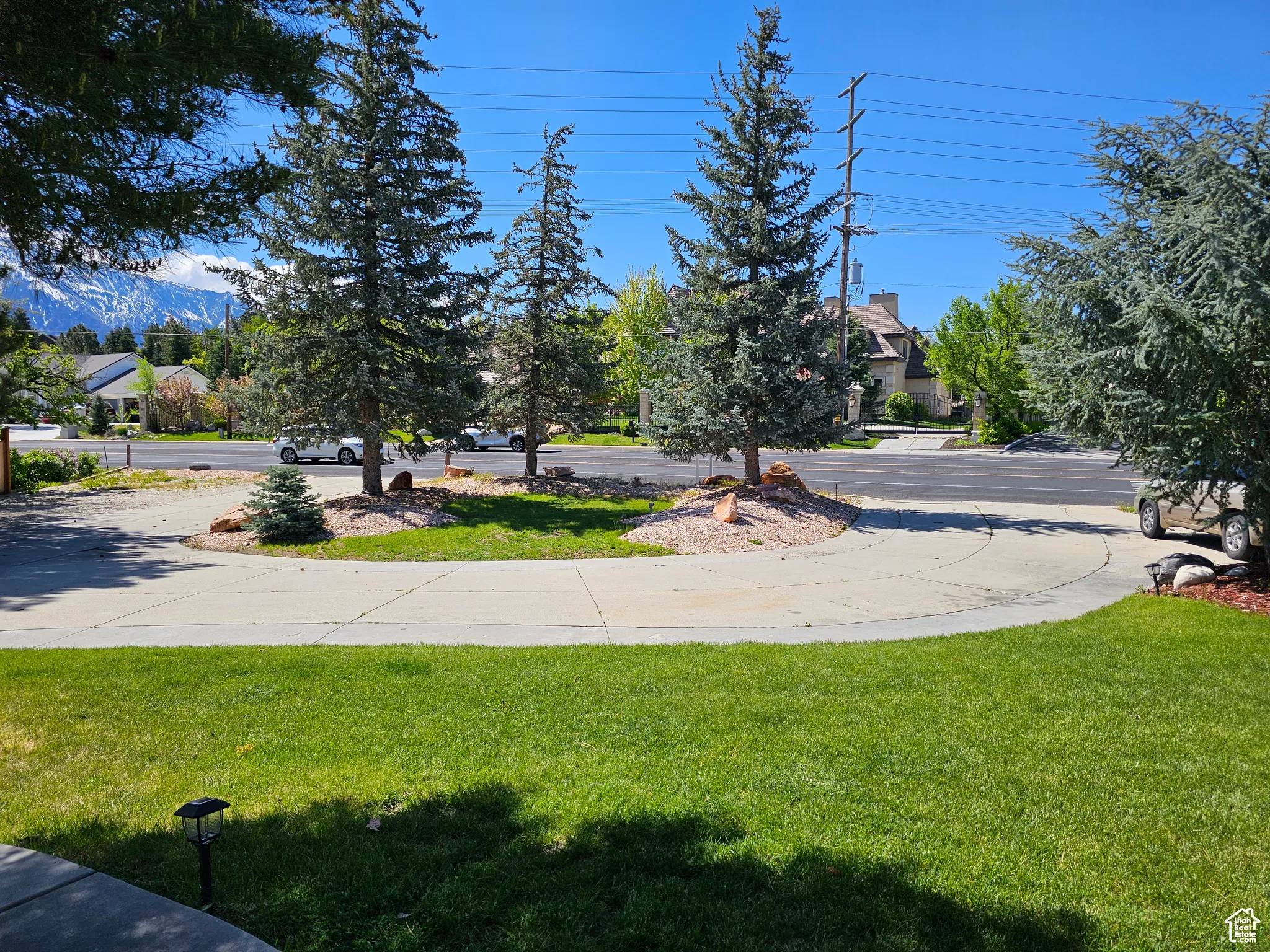 View of green lawn with a mountain view