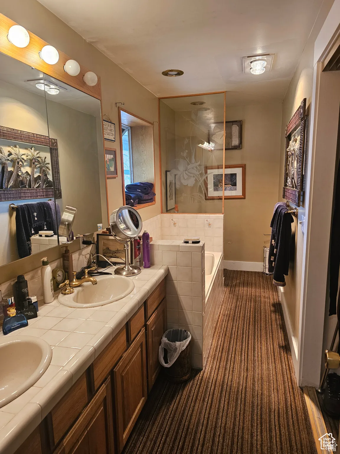 Bathroom with a bath and double vanity