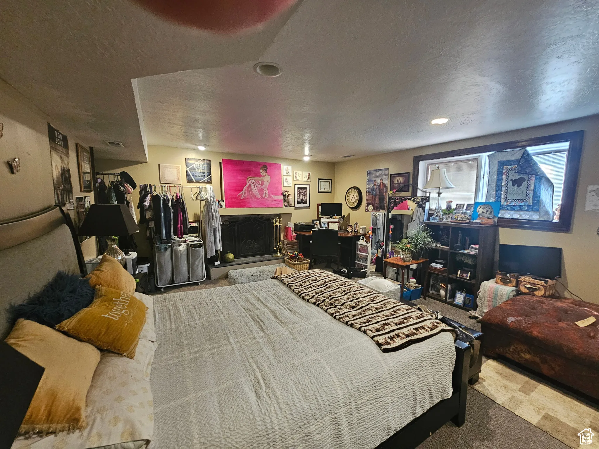Bedroom with carpet flooring and a textured ceiling