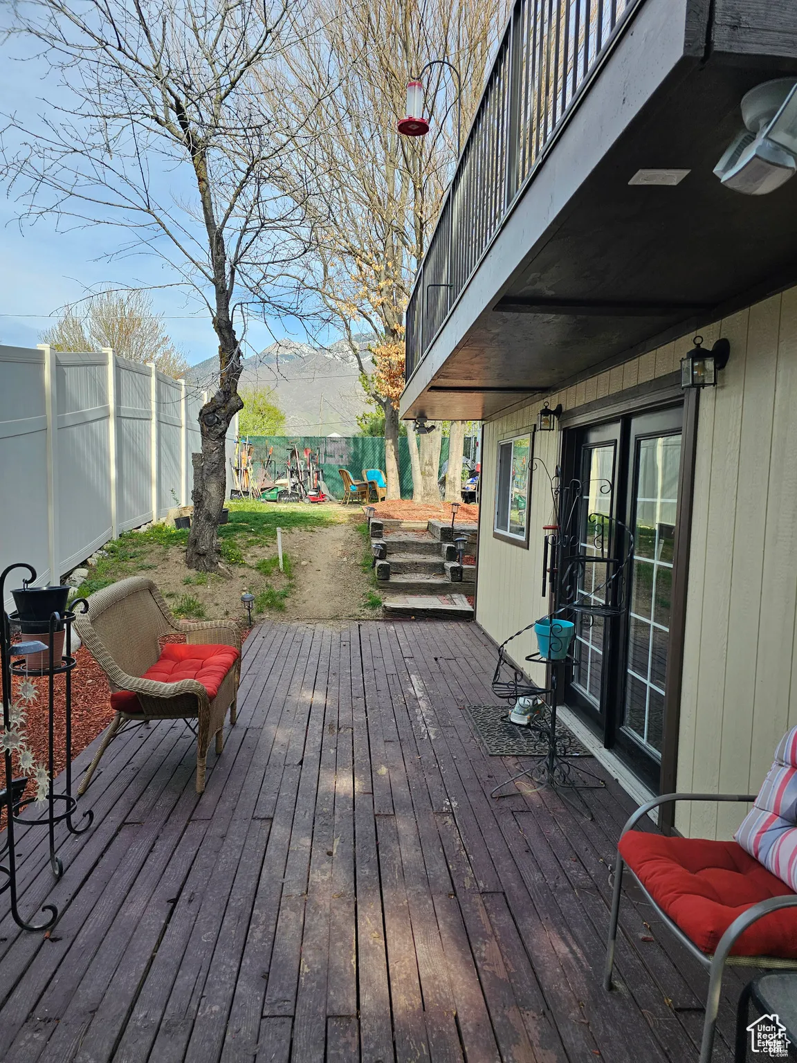 Deck with a fenced backyard