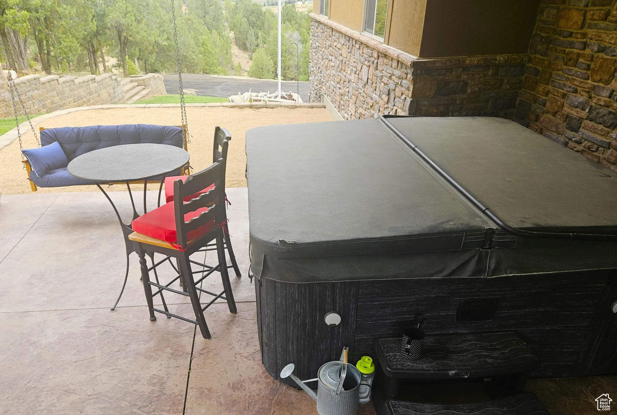 A cozy covered patio with a bubbling hot tub makes this the perfect spot to unwind after a day of adventure.