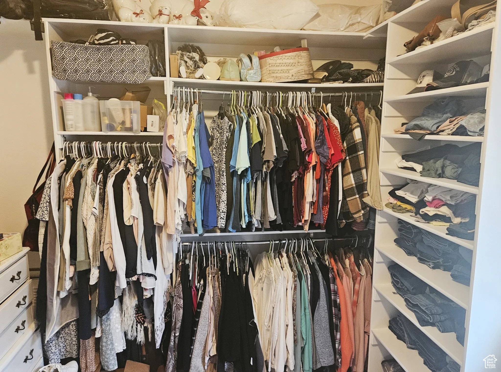 This master walk-in closet offers plenty of room to neatly store and showcase your wardrobe in style.