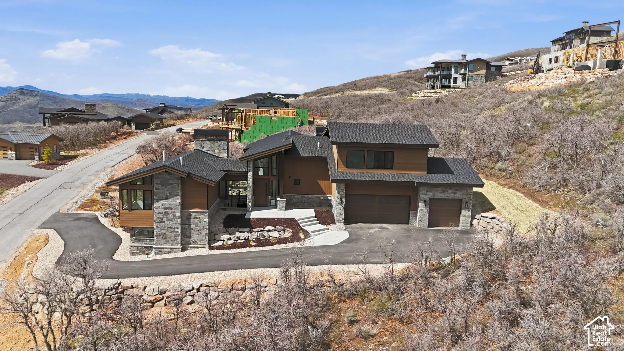 Aerial perspective of suburban area with a mountain backdrop