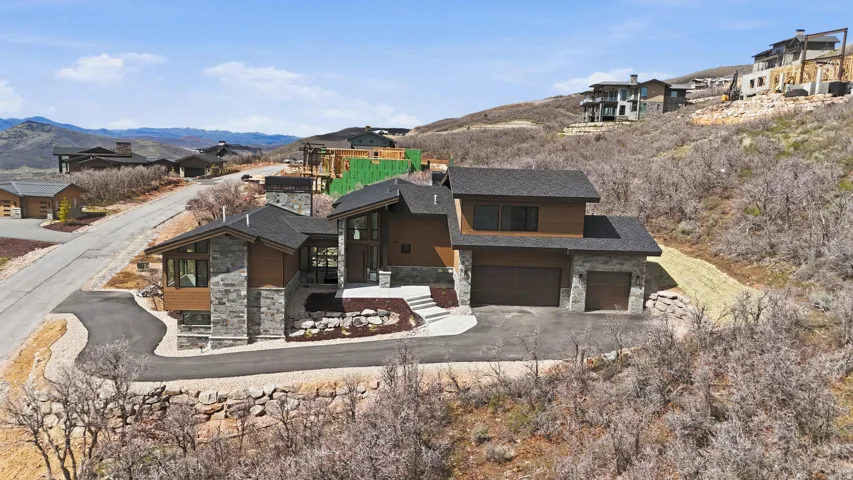 Aerial perspective of suburban area with a mountain backdrop