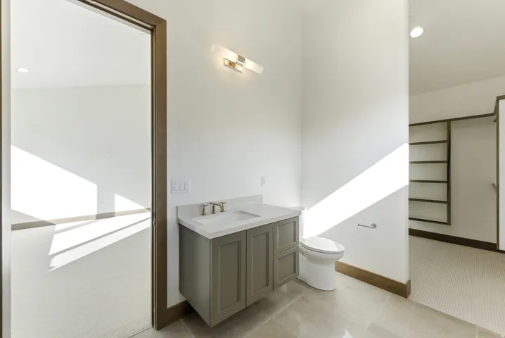 Bathroom with vanity and recessed lighting