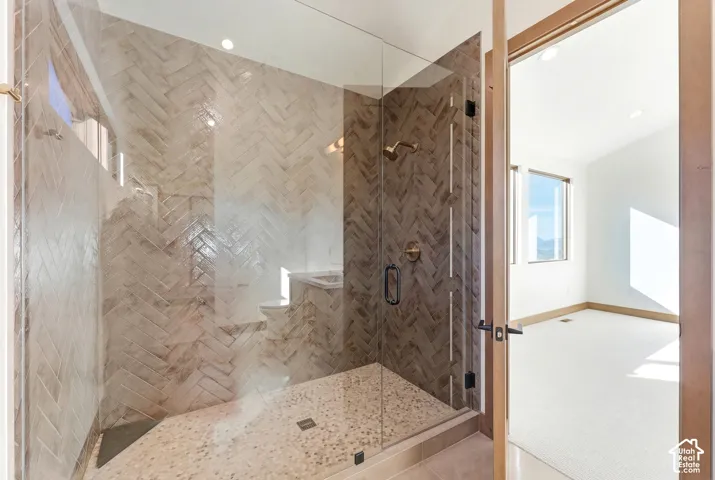 Full bath featuring a shower stall