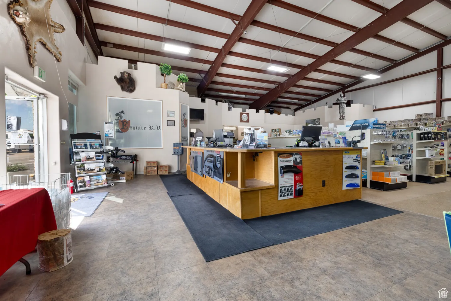 Kitchen featuring beamed ceiling and high vaulted ceiling