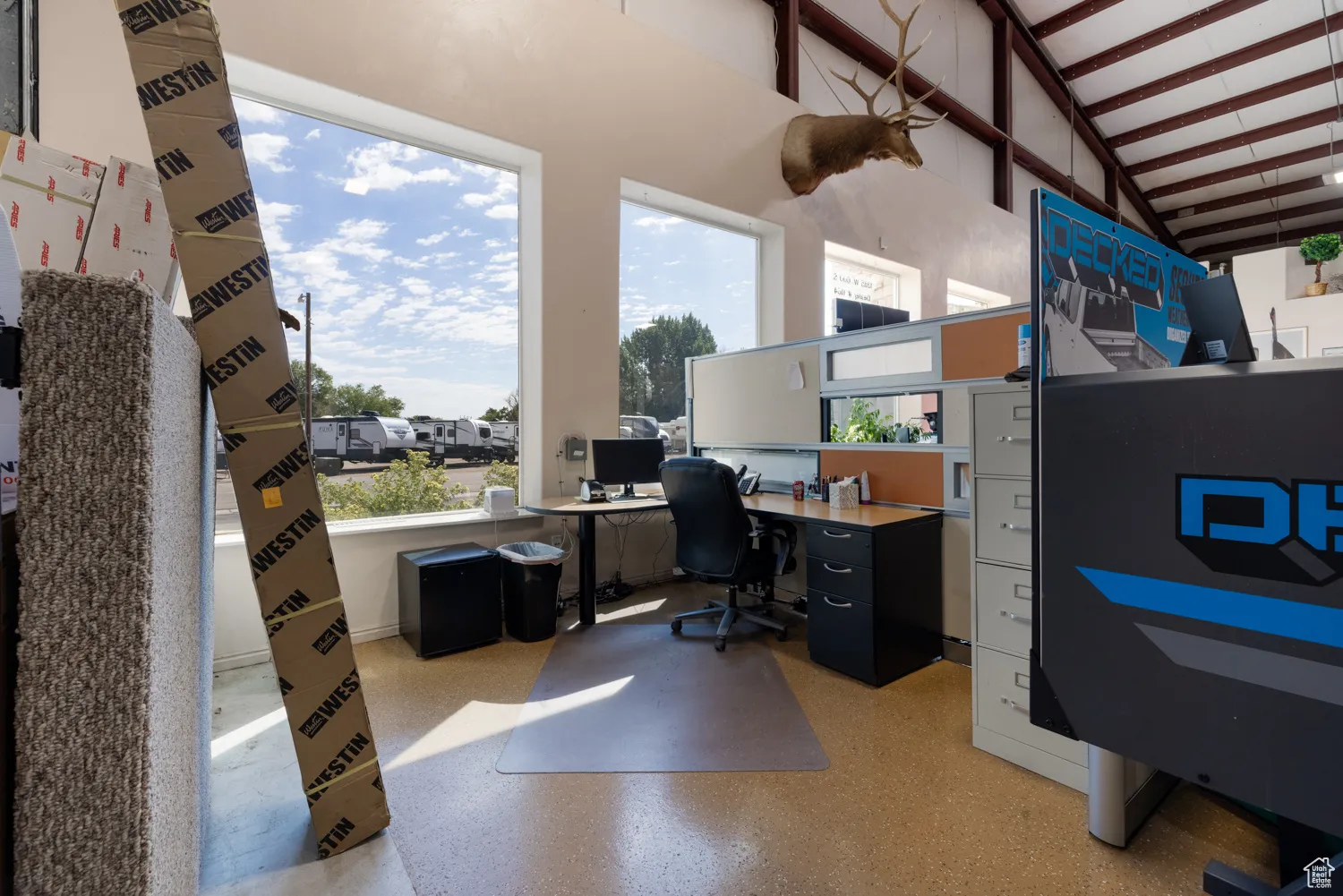 Office featuring high vaulted ceiling