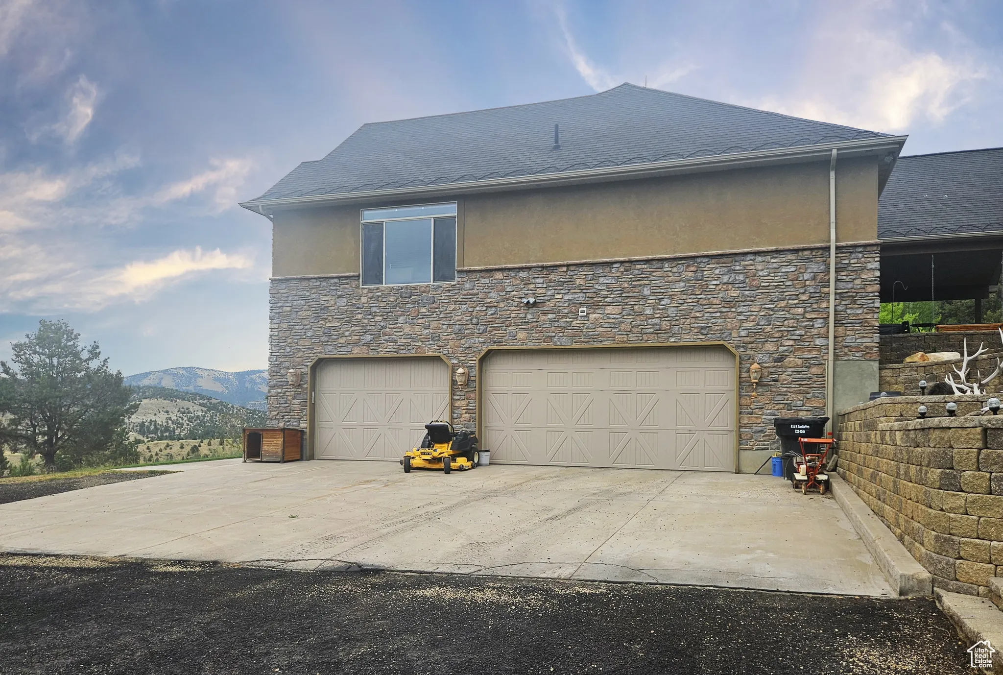 The oversized, heated garage provides ample space for vehicles, equipment, and storage.
