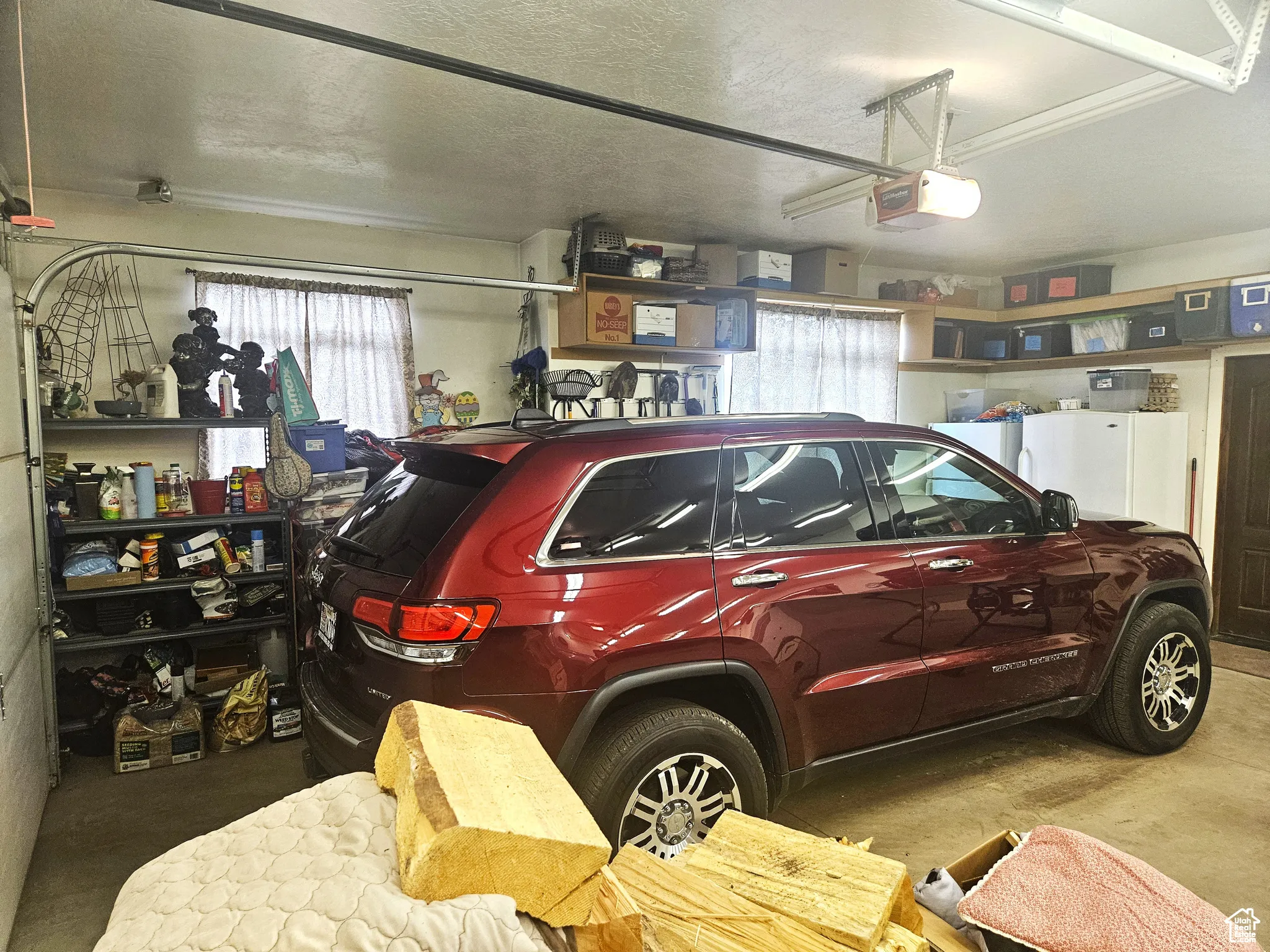 Garage featuring a garage door opener