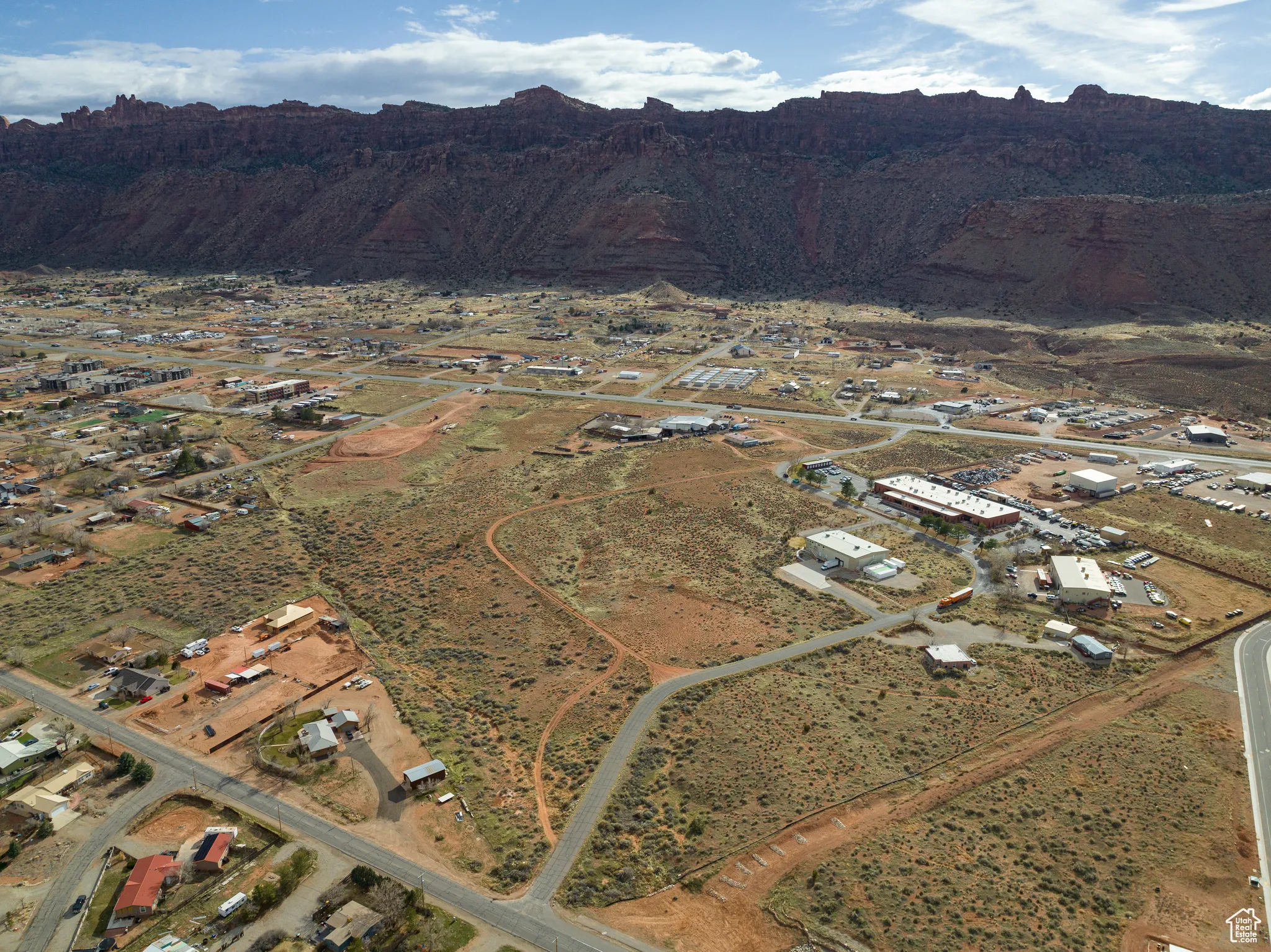 View of mountain backdrop with a desert landscape and rural landscape