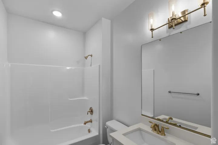 Bathroom with vanity and tub / shower combination