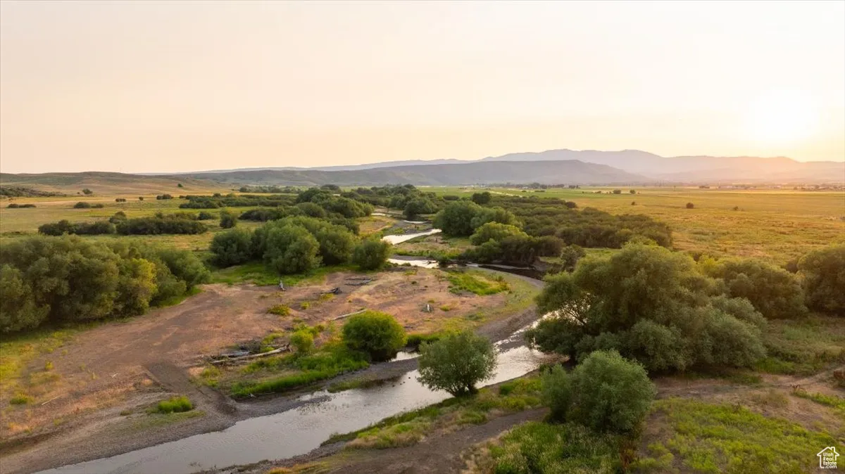 View of mountain backdrop with rural landscape