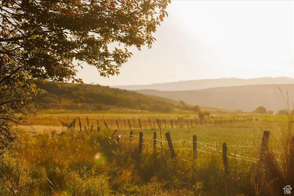 View of mountain backdrop with rural landscape