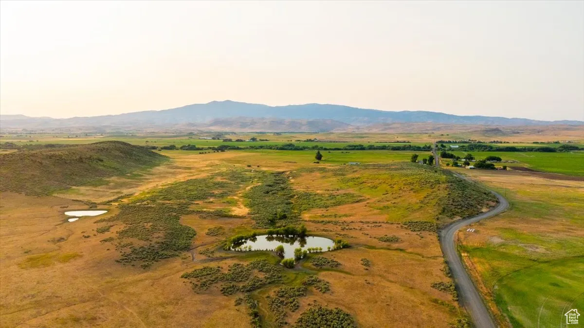 Aerial overview of property's location featuring a water and mountain view