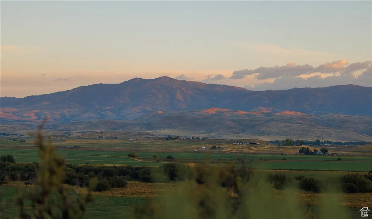 View of mountain background featuring rural landscape