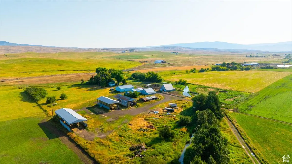 Aerial view of sparsely populated area with a mountain backdrop