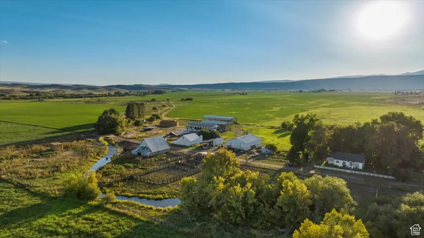 Aerial view of sparsely populated area with mountains and a pastoral area