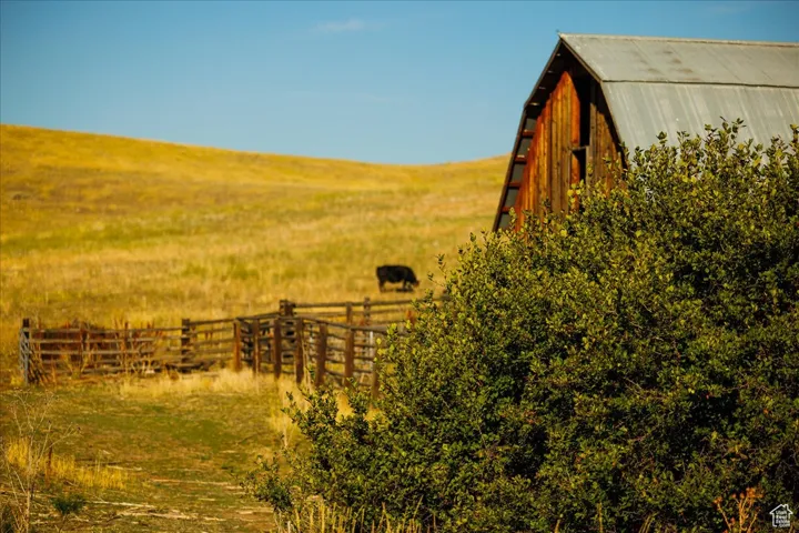 View of yard with a barn and a view of countryside